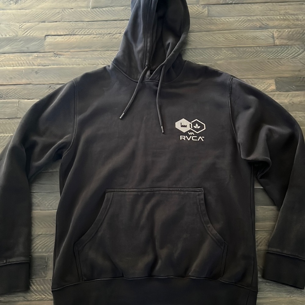 Black RVCA hoodie. Never worn. Left behind in closet and forgotten about.